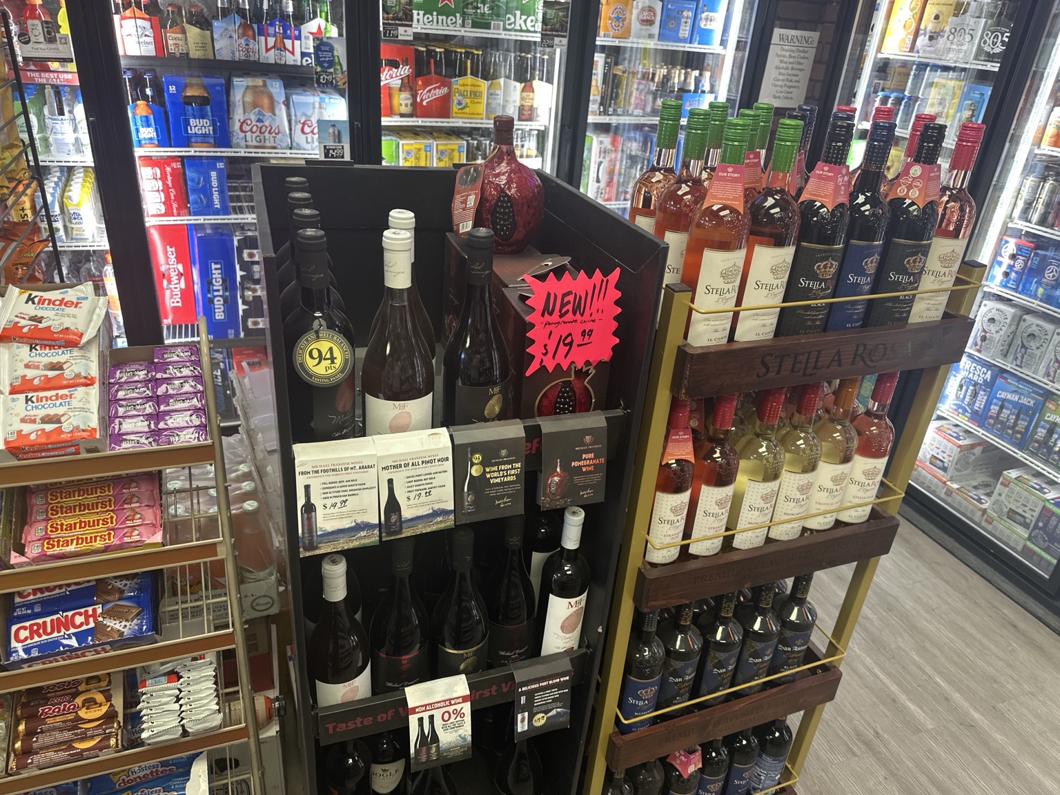 Wine display with cold beer coolers in the background